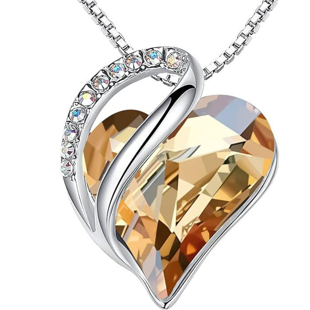 Modern geometric heart pendant necklace, featuring colorful crystals for a radiant look.