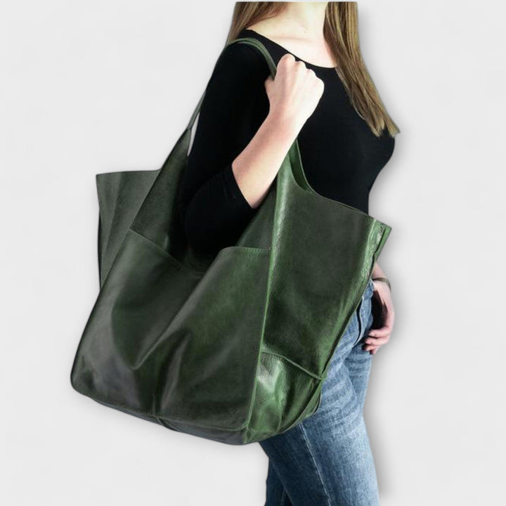 Women's fashion oversized leather travel tote, versatile for gym, work, or weekend trips.
