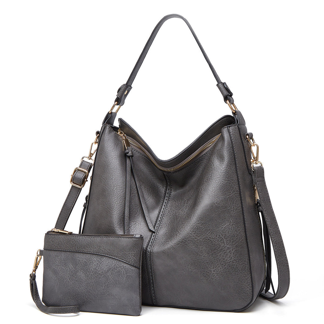 Women's elegant black leather tote bag, perfect for versatile use.