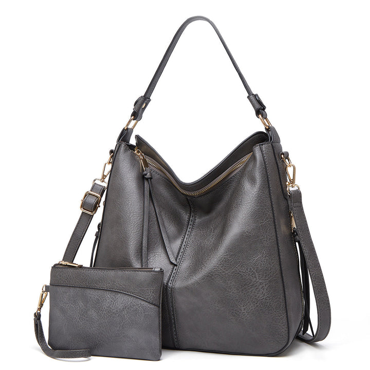 Women's elegant black leather tote bag, perfect for versatile use.