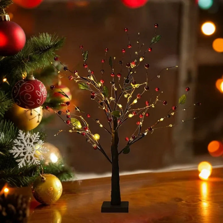 Hand gently bending flexible branches of an LED Bonsai Tree Light, customizing its unique shape effortlessly.