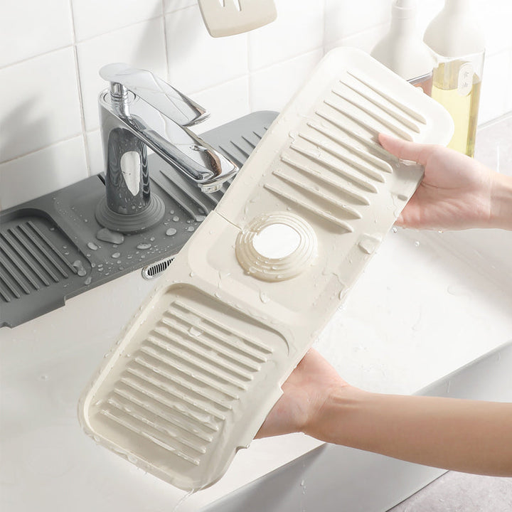 Self-draining silicone mat for kitchen sink, keeps countertops dry & organized.