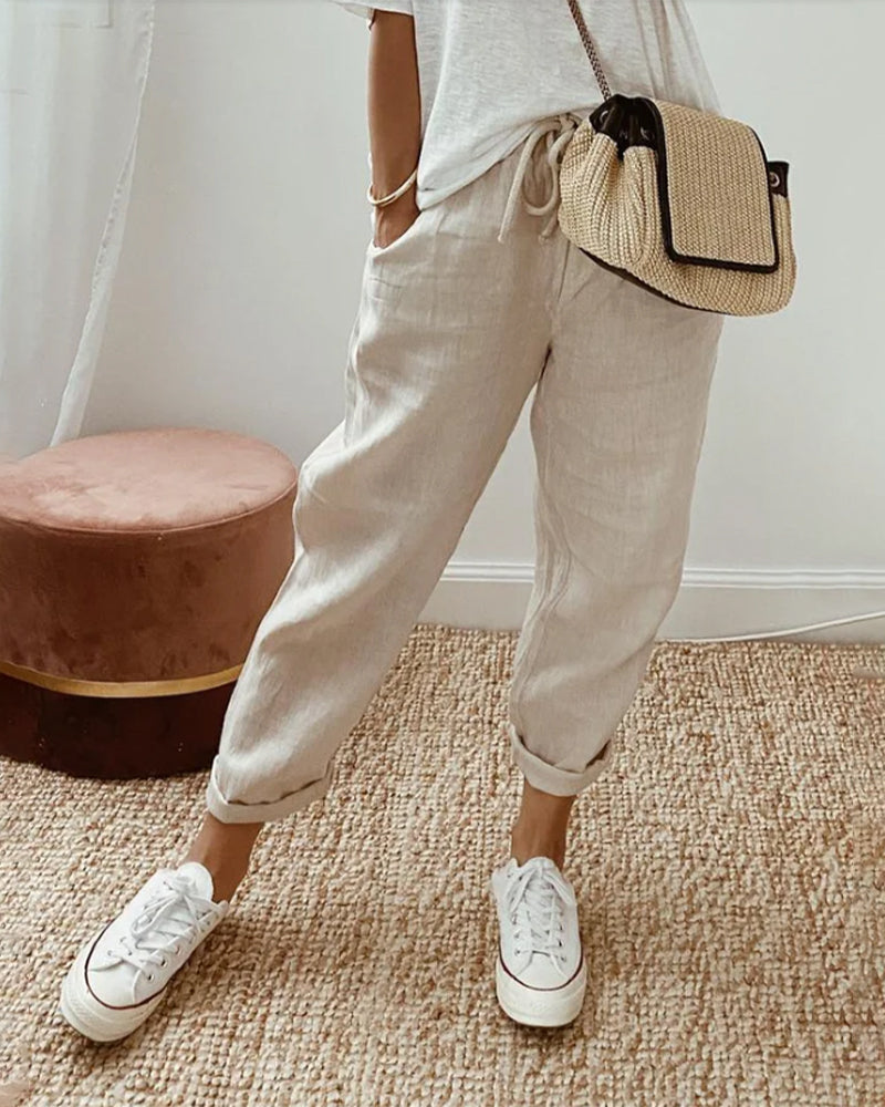 High waist women's tapered trousers with adjustable drawstring, comfortable loose fit casual pants.