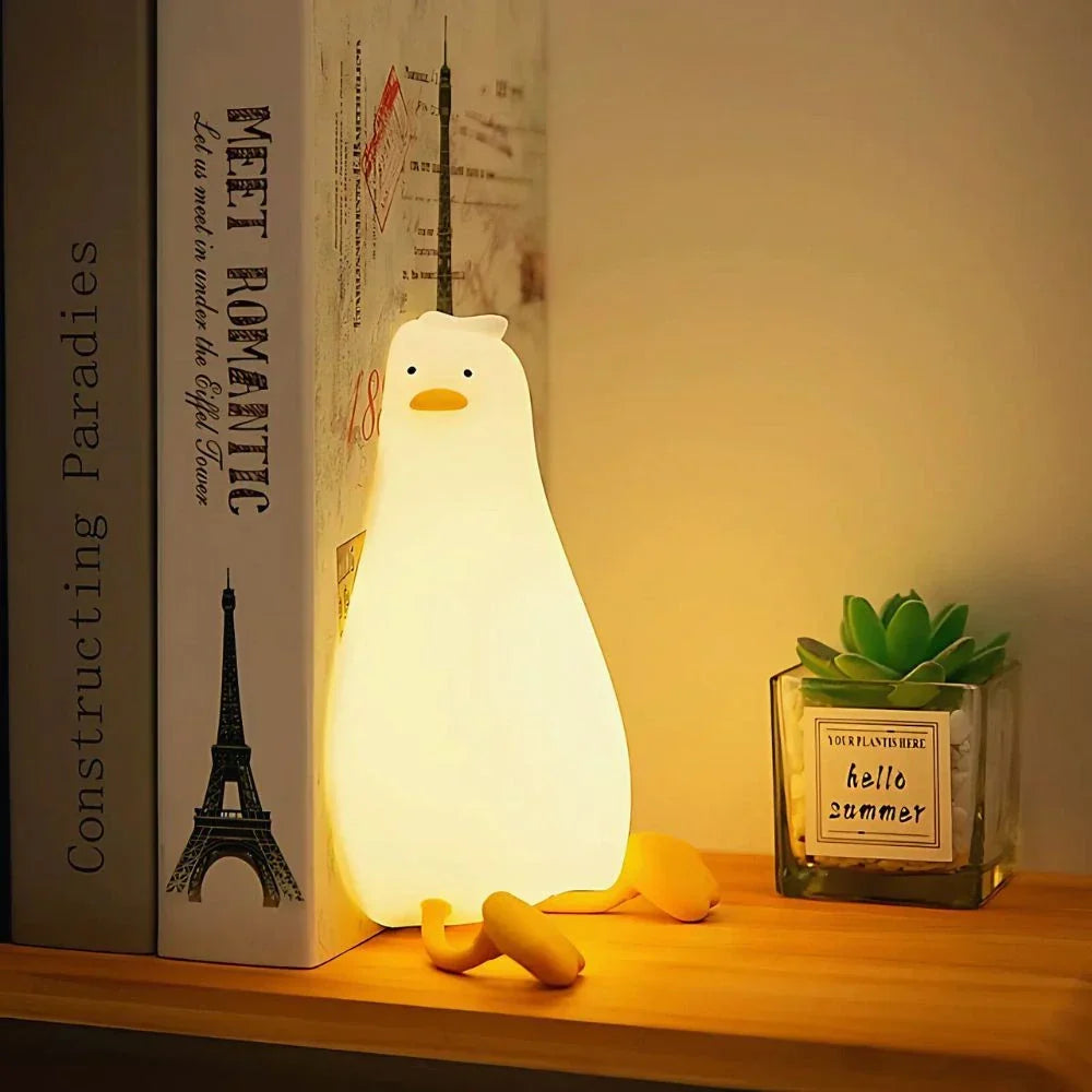Portable LED animal night light by Nvroome; soft silicone, gentle tap dimming for kids' sleep.