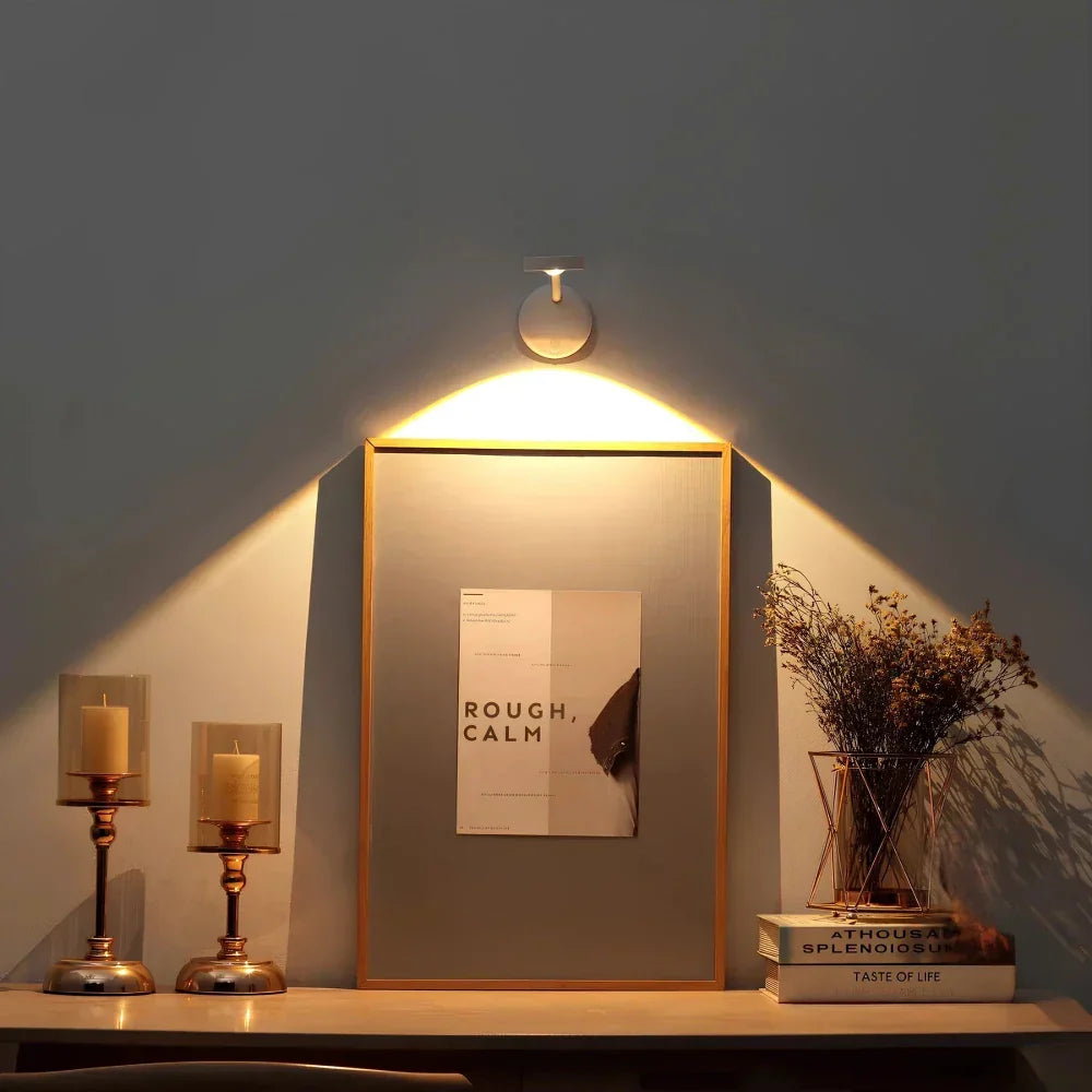 Wall-mounted wireless LED motion sensor light, rechargeable with adjustable beam. Ideal for smart interior lighting.