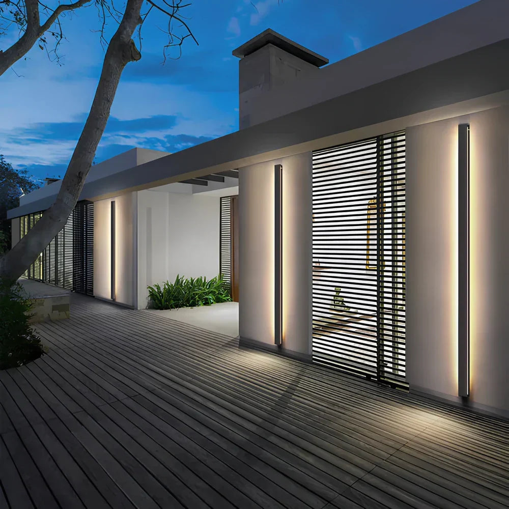 Modern outdoor LED wall sconce, weatherproof linear design for contemporary home facades.