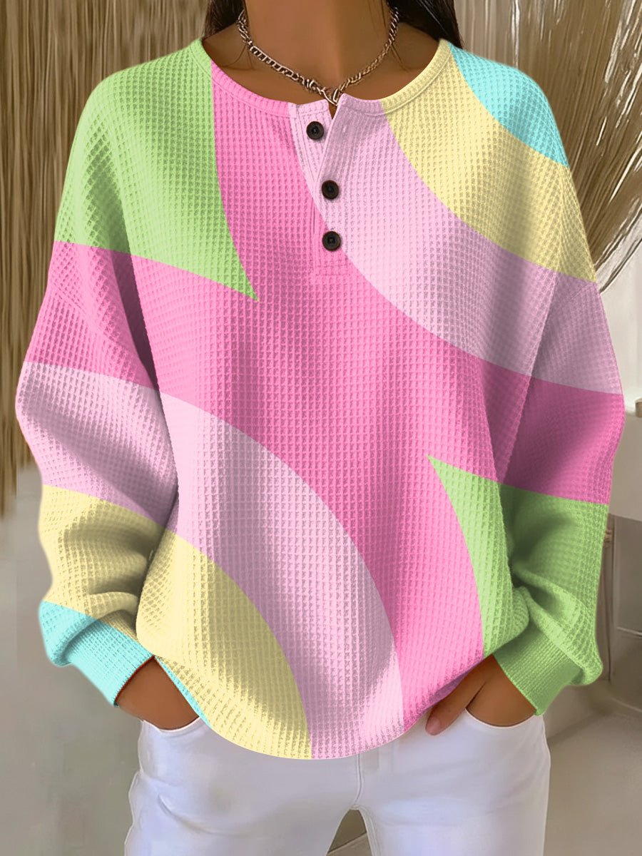 Women's cozy waffle knit sweater in a relaxed fit, perfect for warm winter comfort and casual everyday fashion.