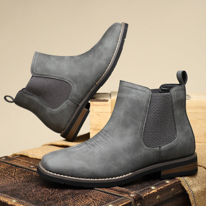 Men's dark brown leather slip-on Chelsea ankle boots. Dressy yet casual, offering comfort and durable style.