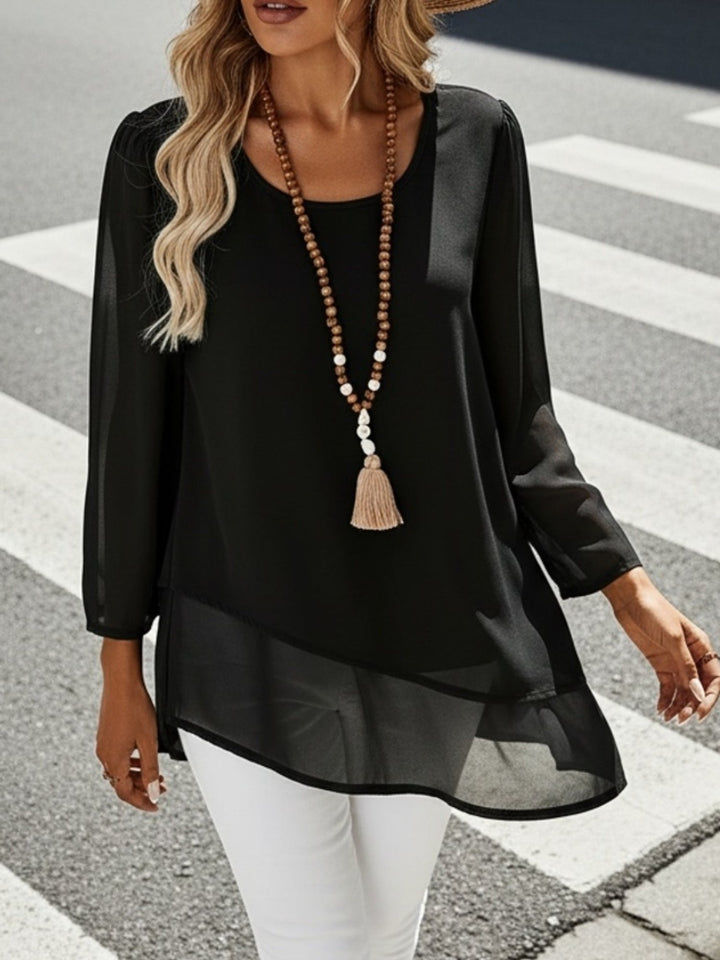 Women's fashion: a layered flowing blouse with a round neck, ideal for versatile styling.