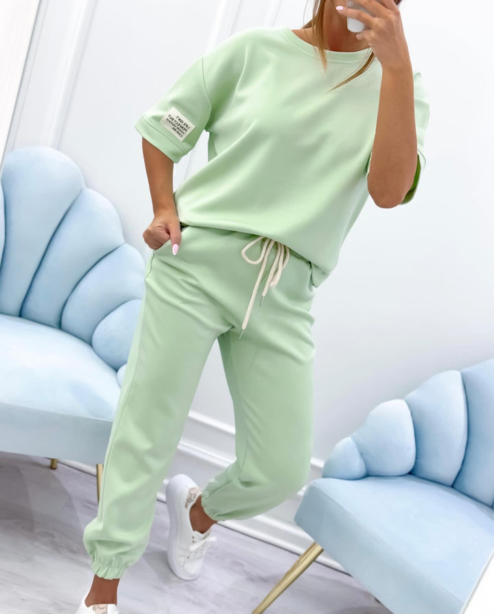 Modern women's short sleeve casual set, an elegant two-piece for comfortable everyday summer wear.