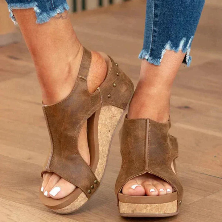 Women's open-toe wedge sandals for summer comfort. Slip-on elegant everyday footwear.