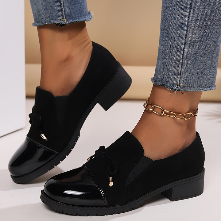 Chic women's dress loafers with an elegant bow accent, offering comfort and timeless style in green.