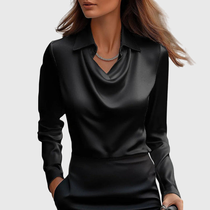 Fashionable women's blouse, elegant and dressy with a stylish pleated neckline. Ideal for office wear.