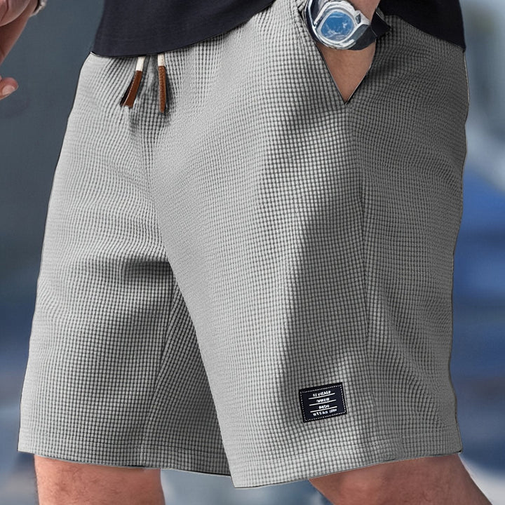 Men's relaxed fit casual shorts in a stylish color, great for summer fashion.