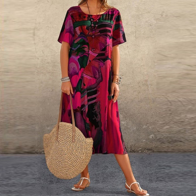 Vibrant women's printed midi dress with artistic design. Casual round neck summer dress for effortless versatile fashion.