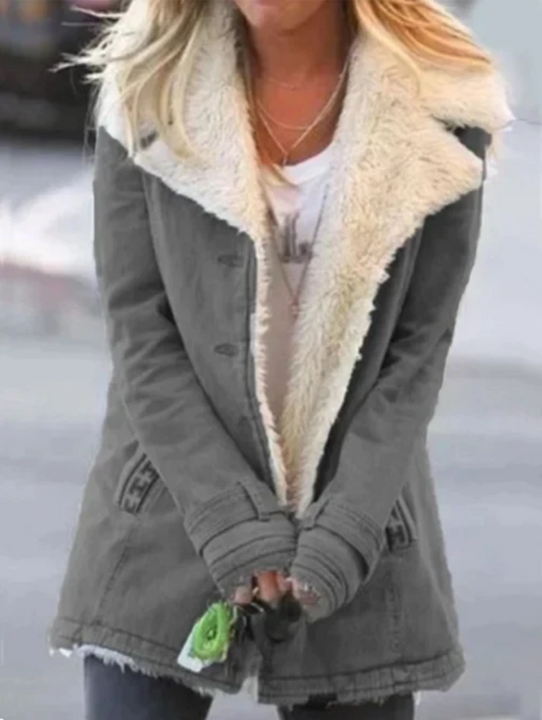 Back view of women's lightweight winter jacket, ensuring full thermal protection.