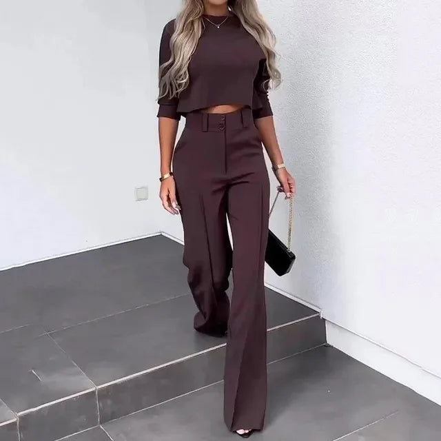 Women's chic autumn set: two-piece outfit featuring a stylish cropped top and tailored pants for fall fashion.