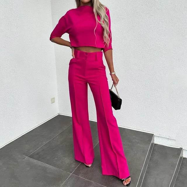 Stylish women's fall fashion set. Elegant two-piece outfit with a chic cropped top and tailored pants for autumn.