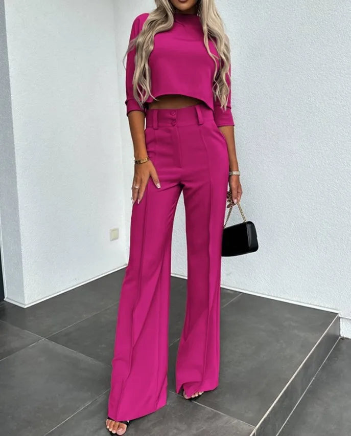 Chic women's matching set, a versatile two-piece autumn outfit. Elegant cropped top & tailored pants for fall style.