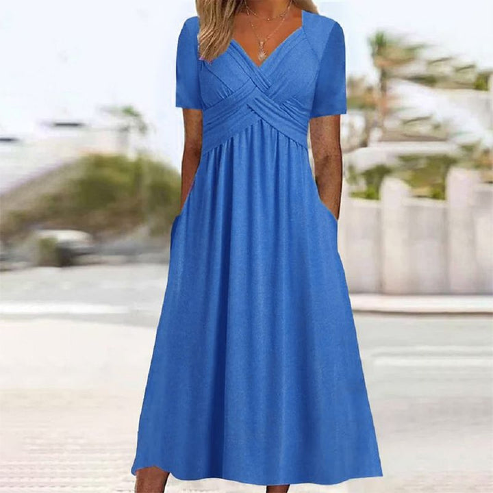 Chic women's silhouette dress with a V-neck, suitable for elegant workwear or comfortable casual outings.