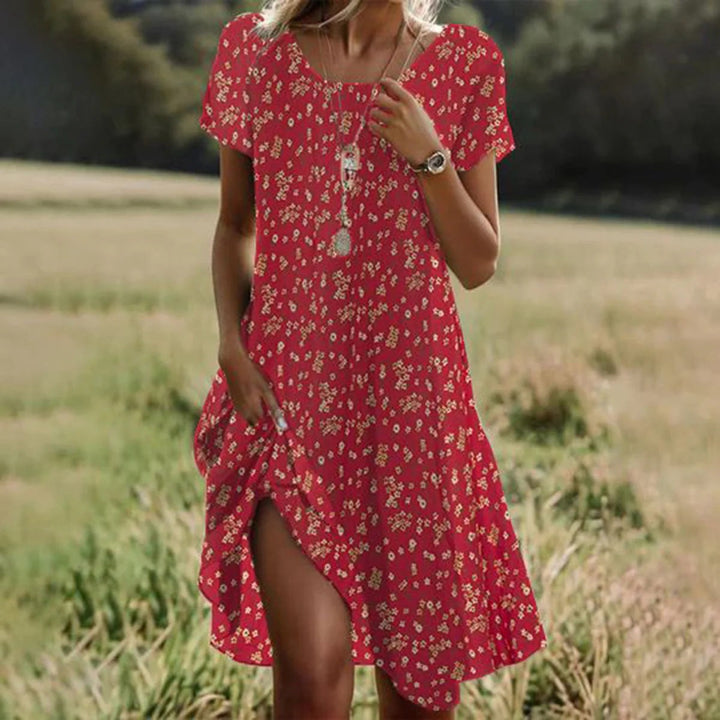 Effortless Sienna boho beach dress, loose fit midi for women, ideal casual vacation outfit with floral design.
