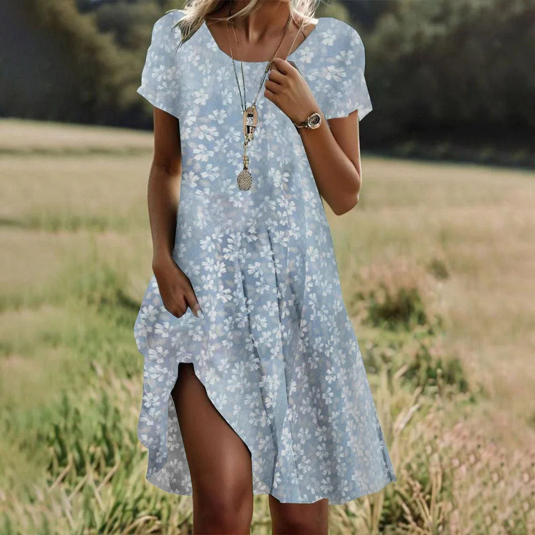Side profile of women's Sienna floral boho summer dress, loose fit a-line midi, chic vacation outfit.