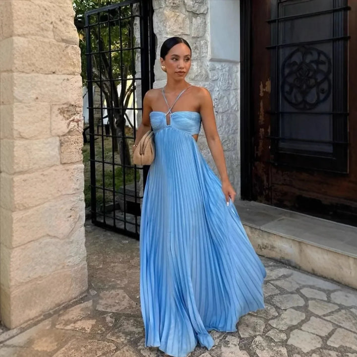 Chic women's pleated halter neck maxi dress, versatile for elegant parties, summer events & wedding guests.