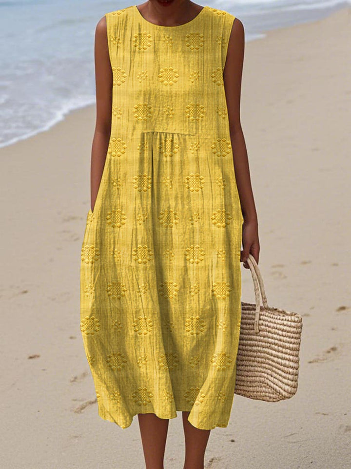 Close-up of elegant embroidery on a women's summer midi dress, showcasing unique detailing and spring style.