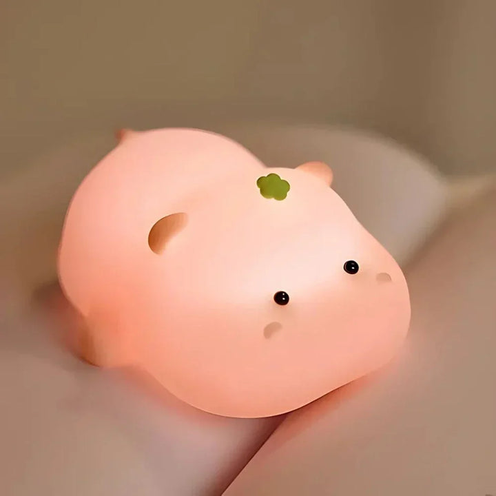 Soft touch silicone animal LED lamp; dimmable kids night light with gentle tap control.