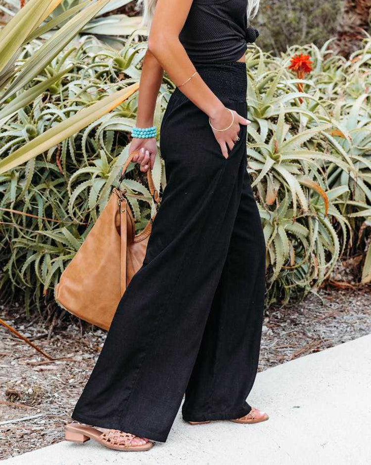 Comfortable women's summer wide leg trousers in a breathable linen blend fabric with elastic waist.