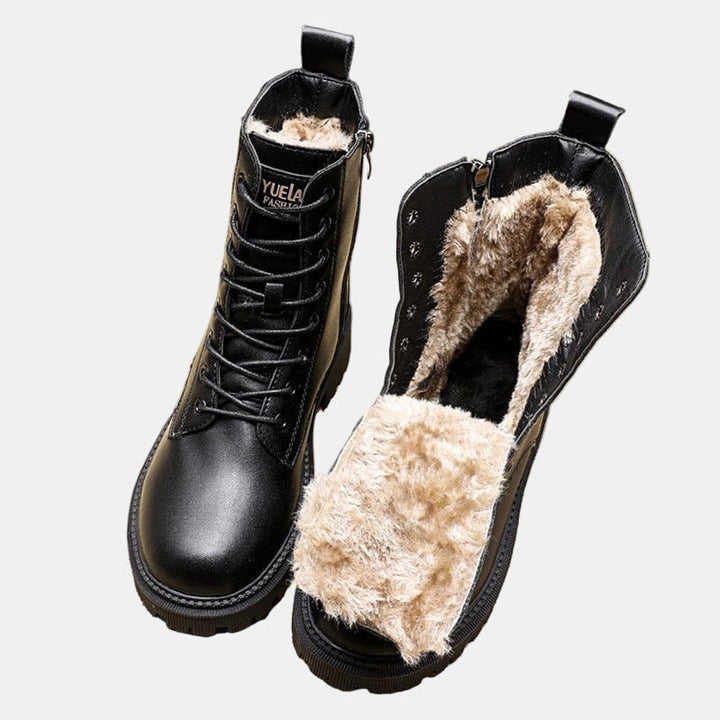 Women's black lace-up combat ankle boots with lug sole for winter warmth & stylish everyday casual wear.