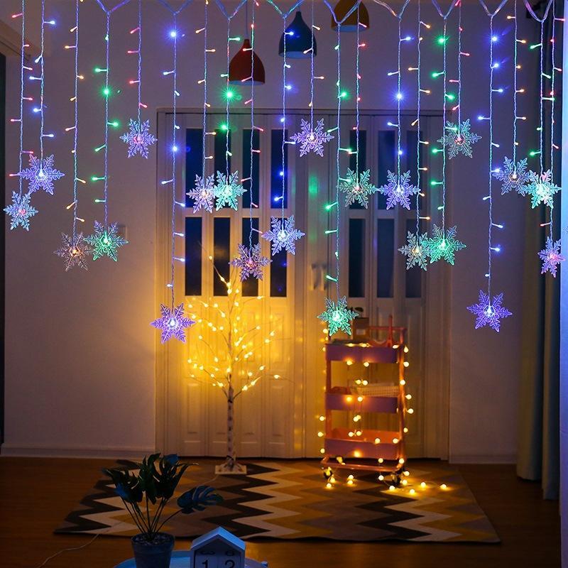 Sparkling LED snowflake string lights, perfect for festive indoor & outdoor ambiance.