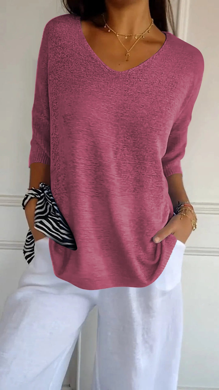 Comfortable women's V-neck top with long sleeves, ideal for casual wear or dressing up with ease. [[lstfy-media:4]]