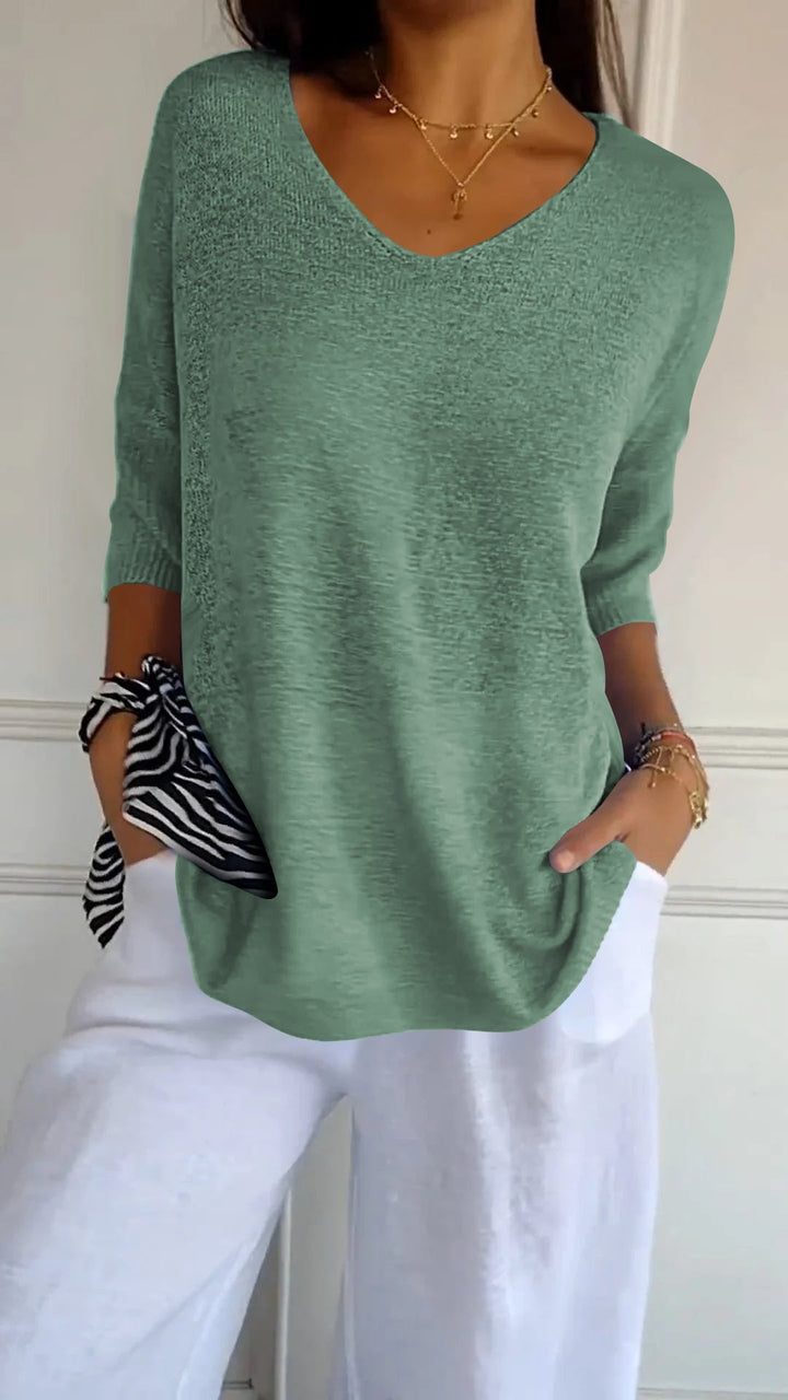 Chic women's V-neck long sleeve top, perfect for adding an elegant and comfortable touch to any outfit. [[lstfy-media:8]]