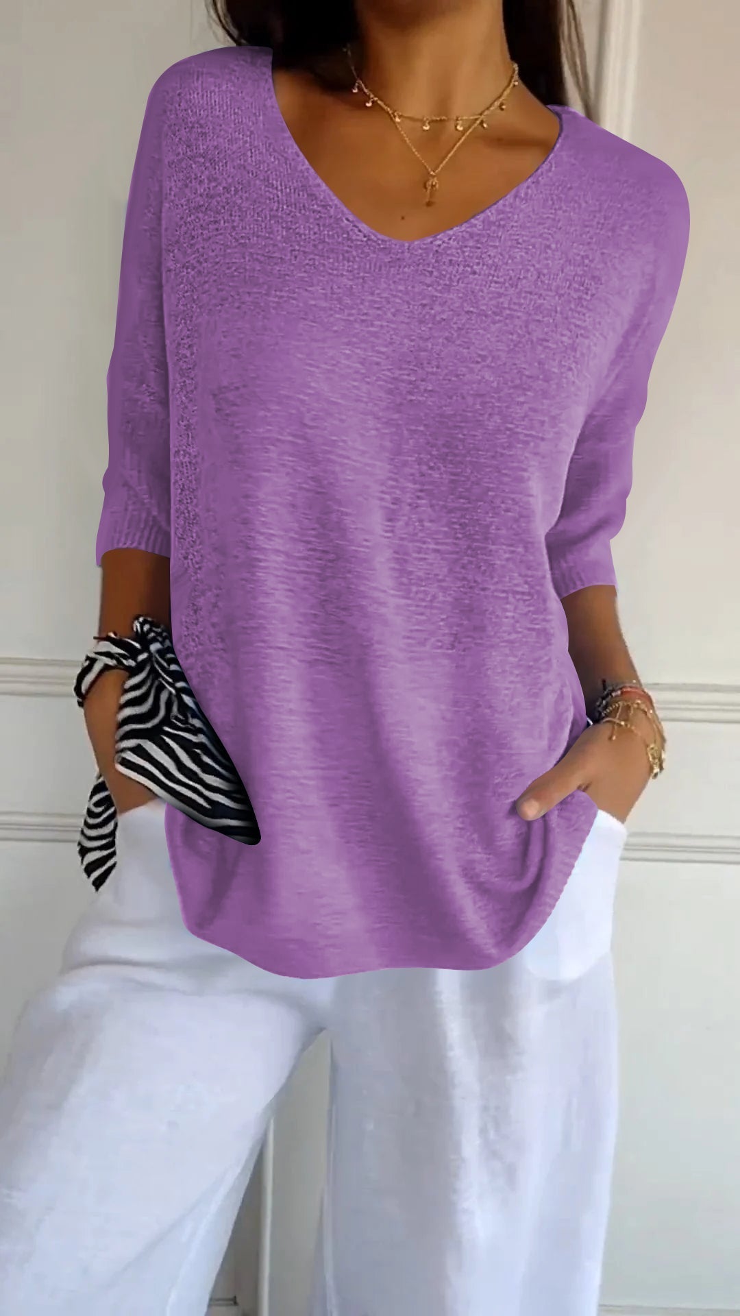 Soft, casual women's V-neck long sleeve top, combining comfort with modern, stylish design. [[lstfy-media:6]]