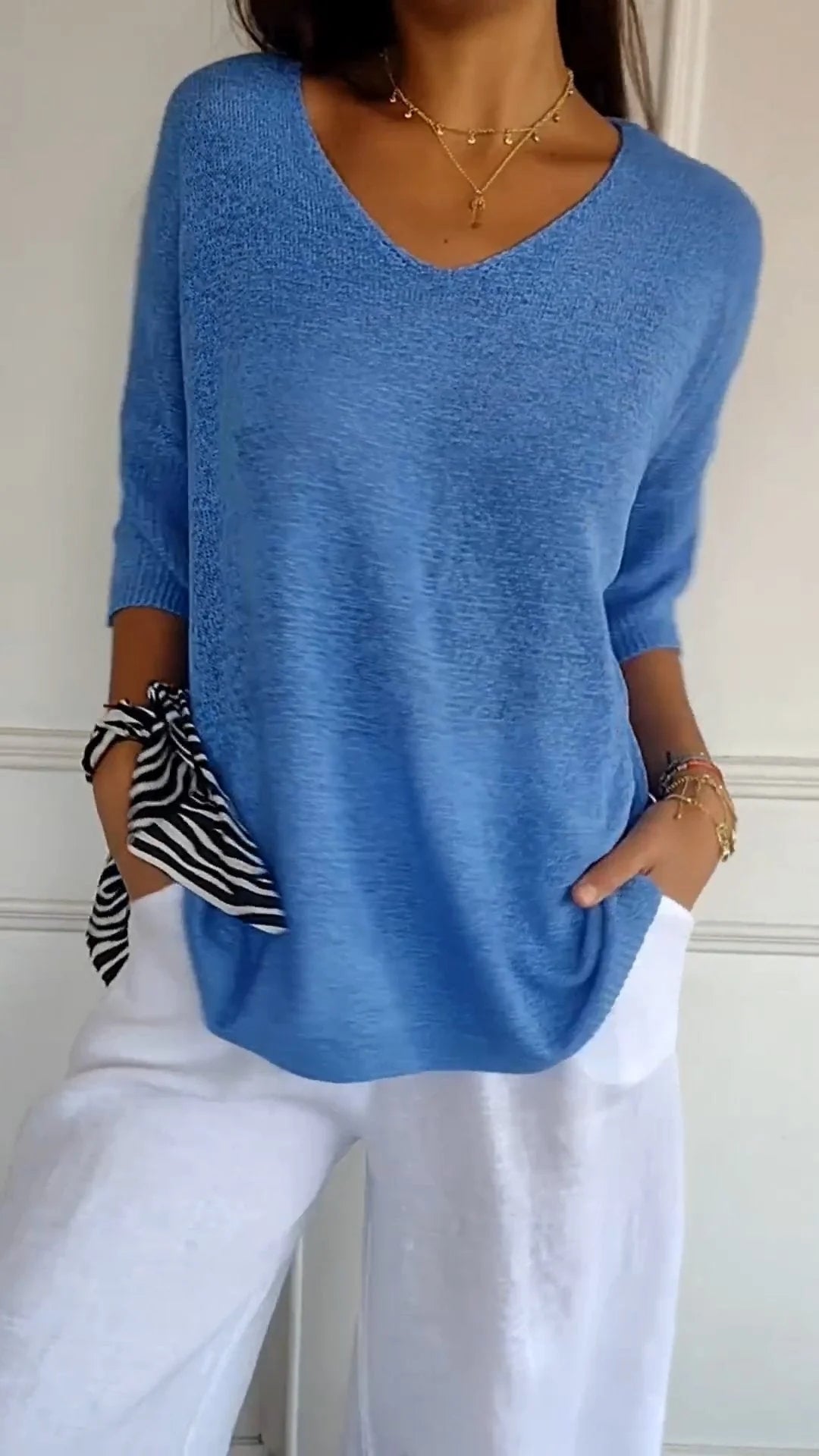 Stylish women's V-neck top, a comfortable long sleeve essential for versatile everyday fashion. [[lstfy-media:2]]