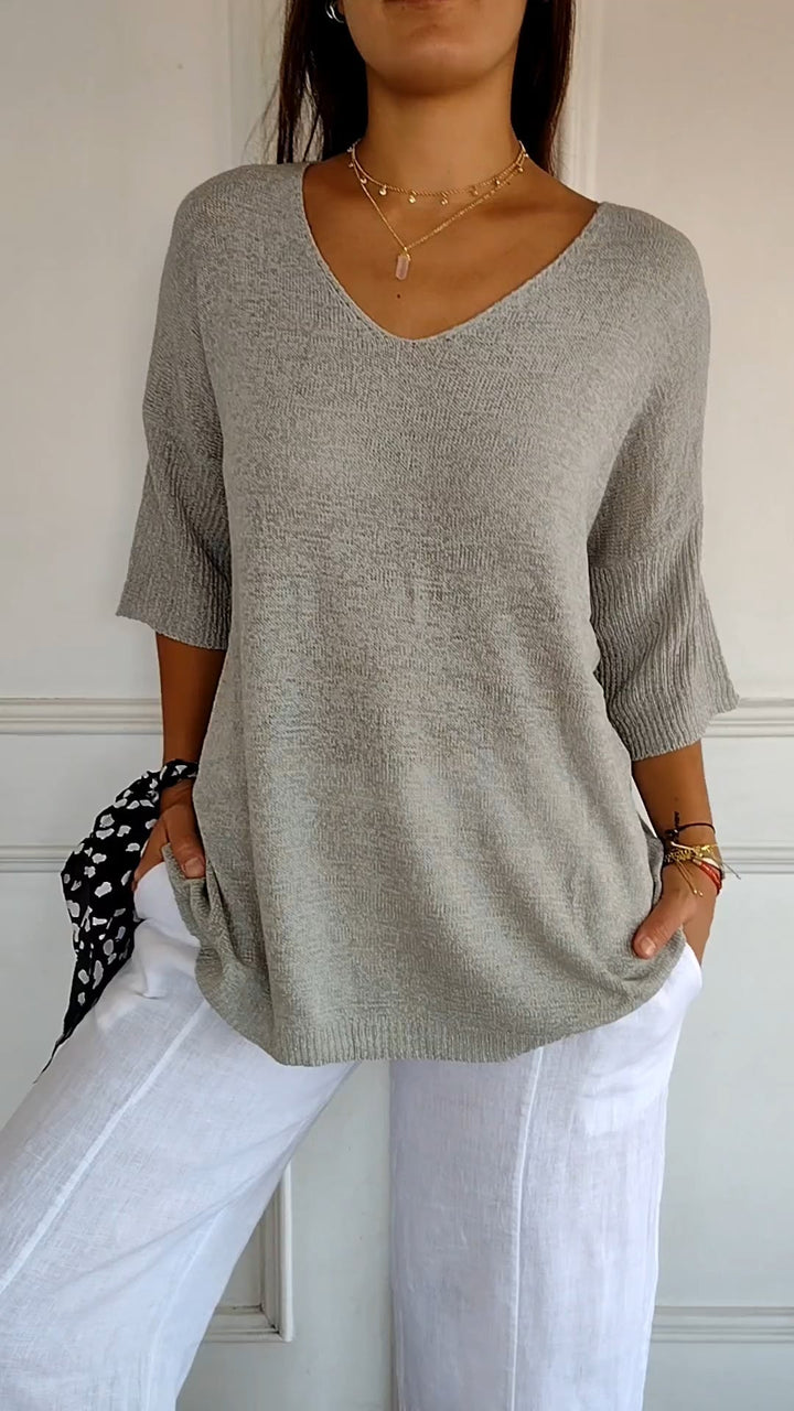 Everyday essential women's V-neck top, comfortable long sleeves for casual yet stylish fashion. [[lstfy-media:9]]
