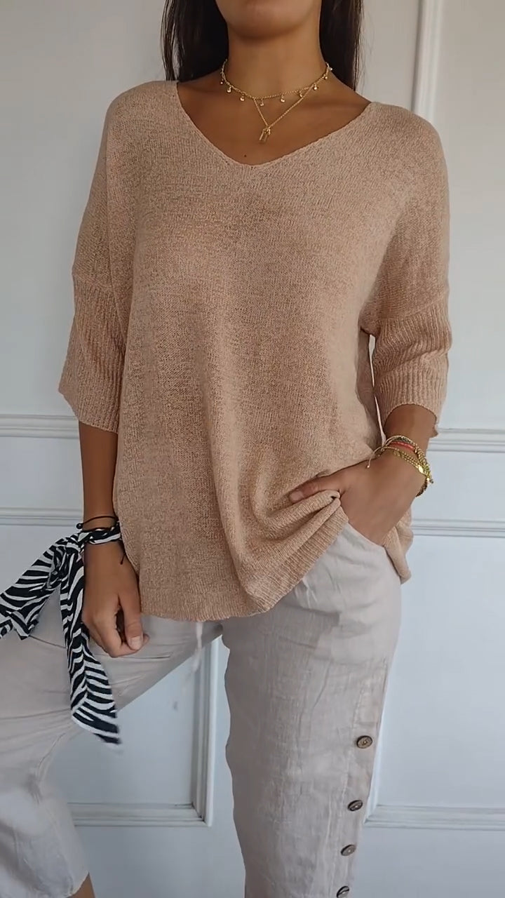 Elegant V-neck long sleeve top for women, offering chic comfort and versatile style for any occasion. [[lstfy-media:3]]
