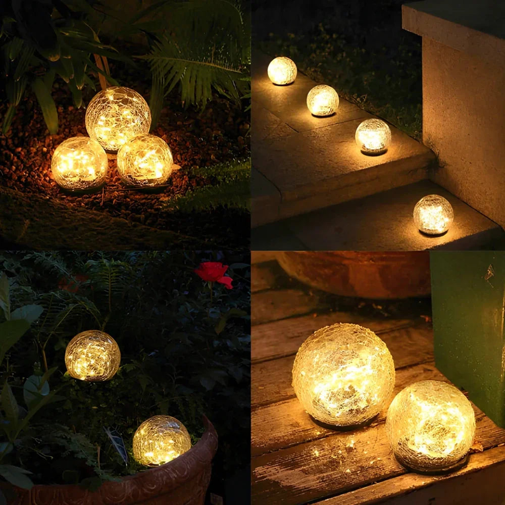 Beautiful solar crackled glass orb garden light, warm white LED for charming outdoor spaces.