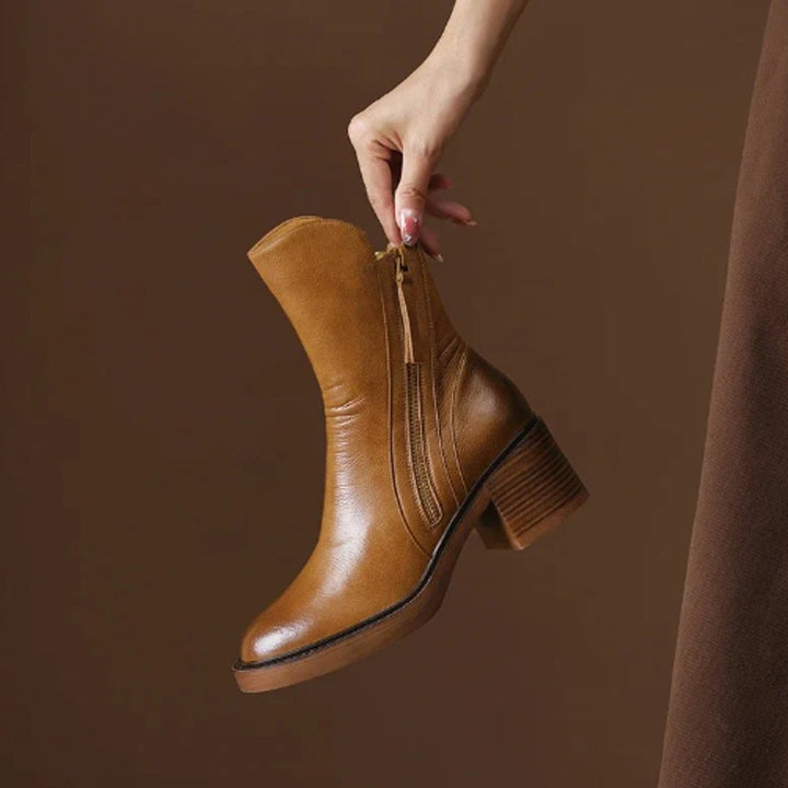 Elegant brown women's ankle boots with a comfortable block heel and practical side zip closure.