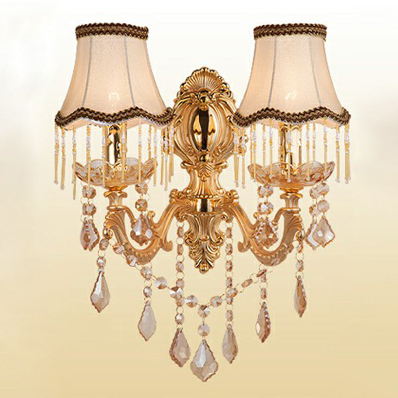Decorative Victorian wall sconce, combining sturdy metalwork, a refined shade, & shimmering crystal elements.