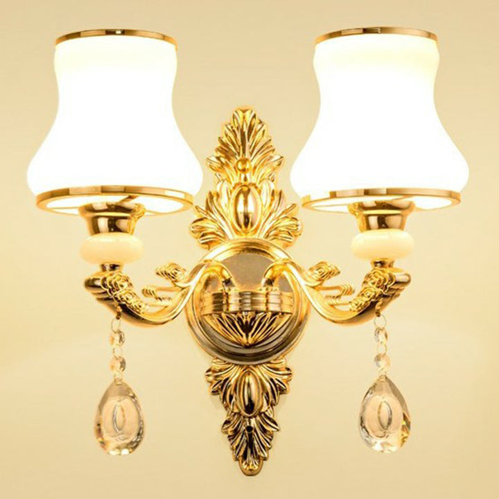 Close-up of shimmering crystal pendants on an ornate Victorian wall lamp. Luxurious traditional home accent.