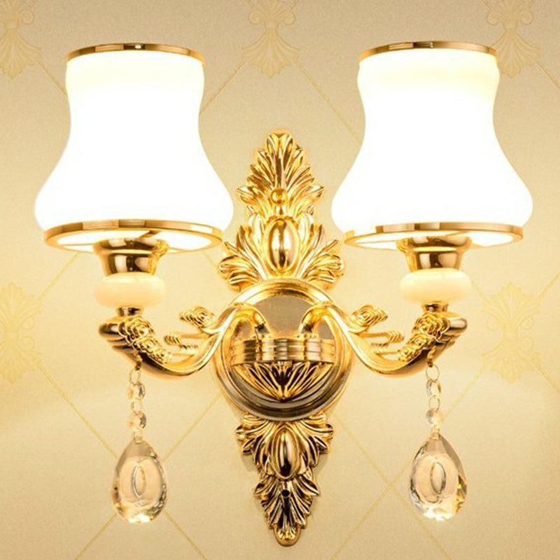 Vintage-inspired Victorian wall lamp with a fabric shade & delicate crystal decor, enhancing classic home styles.