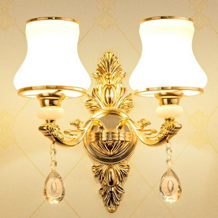 Vintage-inspired Victorian wall lamp with a fabric shade & delicate crystal decor, enhancing classic home styles.