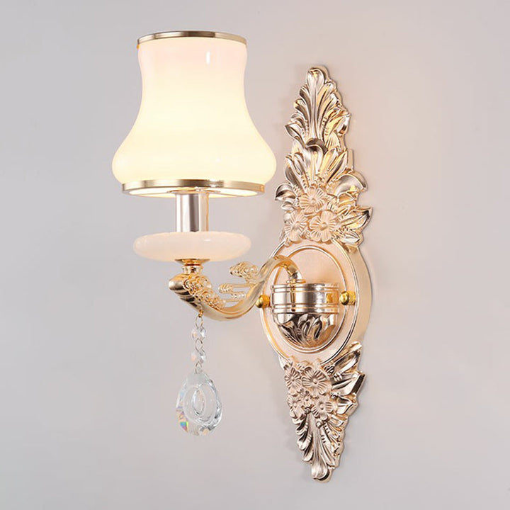 Elegant gold Victorian wall lamp mounted, featuring a classic shade & decorative crystal details for home accent.