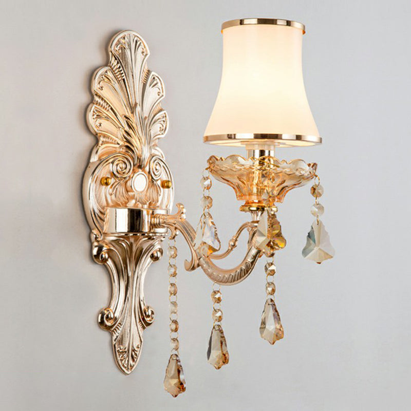 Sparkling crystal accents on an elegant Victorian silver wall lamp, adding luxury to traditional decor.