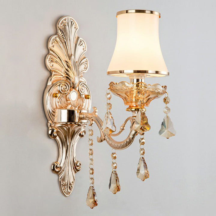 Sparkling crystal accents on an elegant Victorian silver wall lamp, adding luxury to traditional decor.