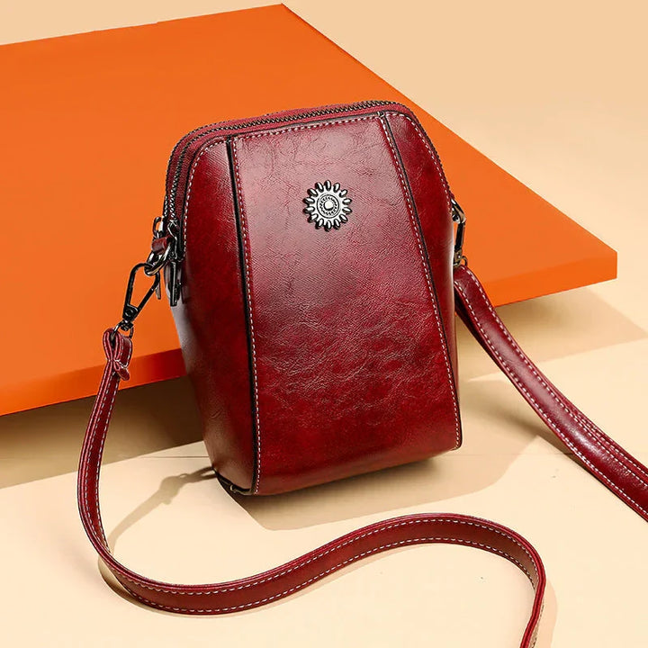 Chic red leather shoulder bag for women, versatile and stylish, an everyday handbag accessory.