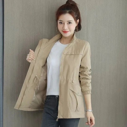 Women's waterproof rain jacket with cinched waist for stylish comfort and everyday wear.