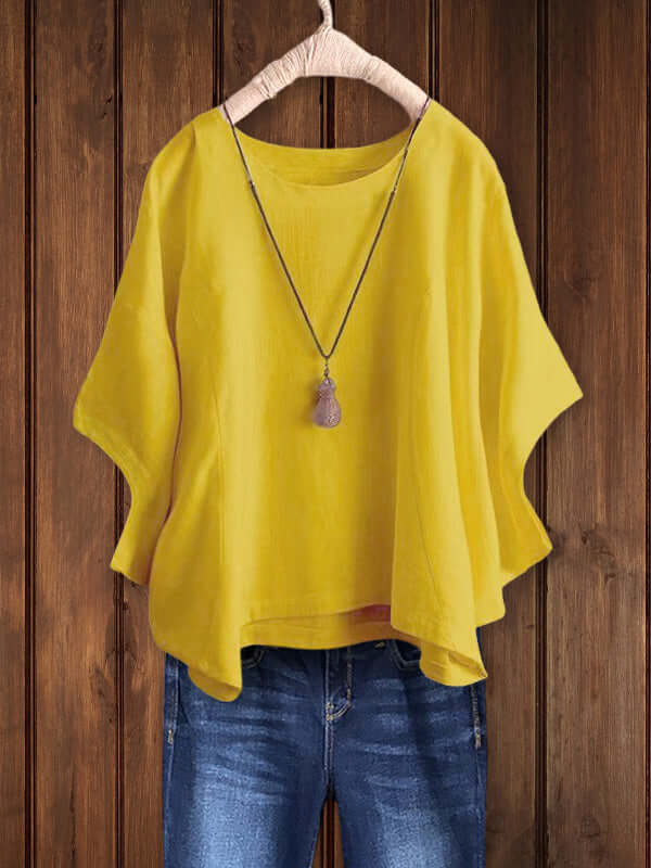Comfortable women's dolman-sleeve tunic top with crew neck. Versatile for casual spring and summer everyday wear.